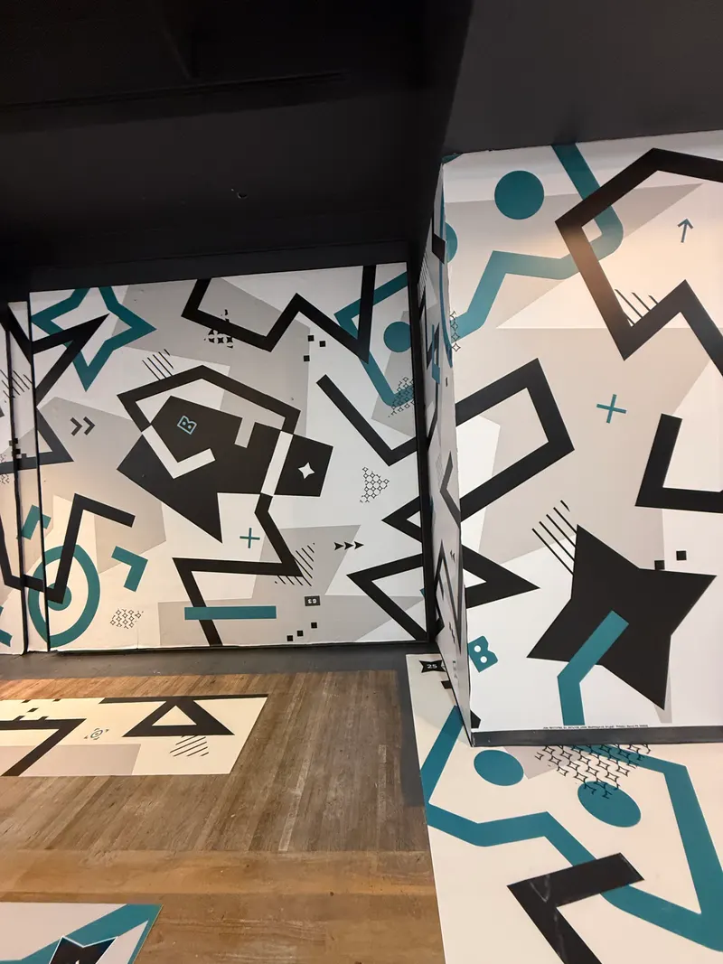 Geometric teal and black commercial wall mural
