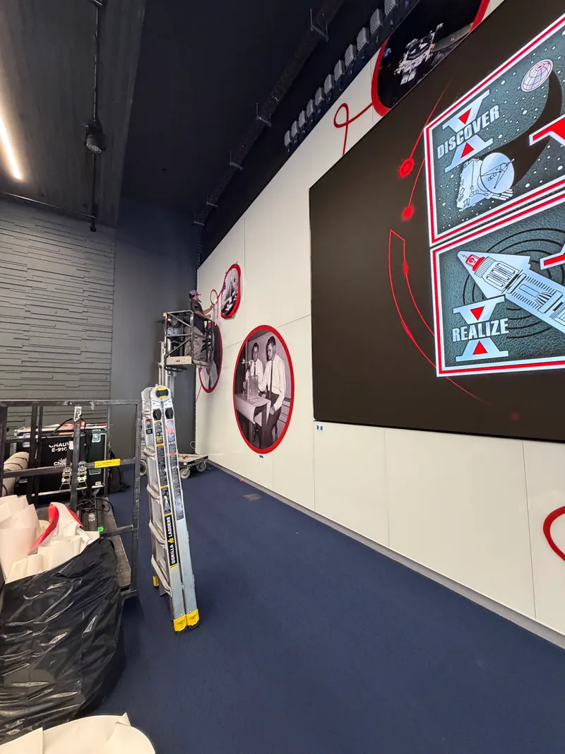 Crew installing wall graphics at JHU APL